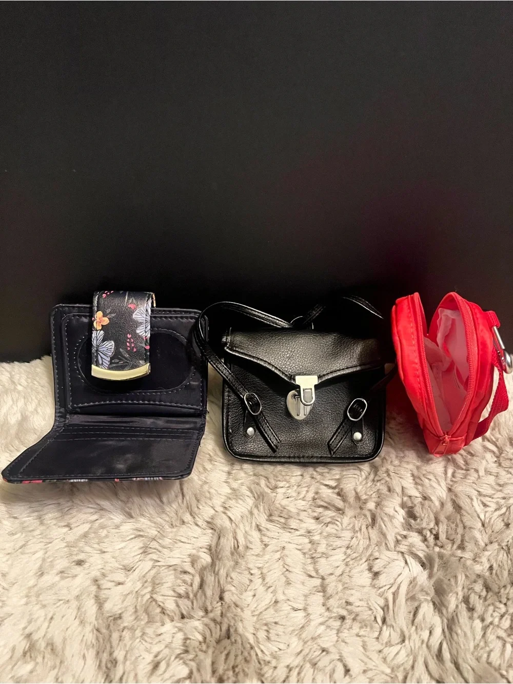 Three piece bundle of two coin, purses, and one small wallet